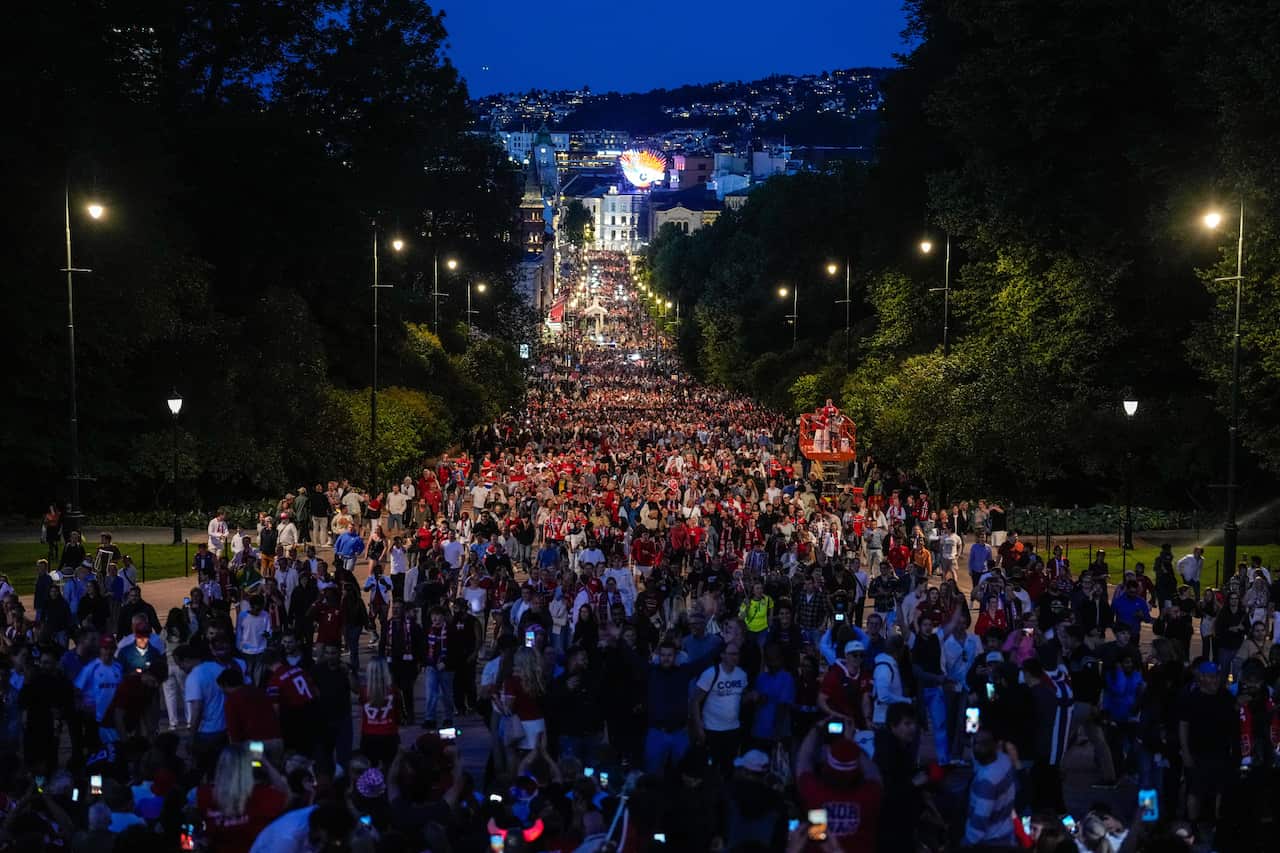 Thousands of Norwegian football fans on a street in Oslo