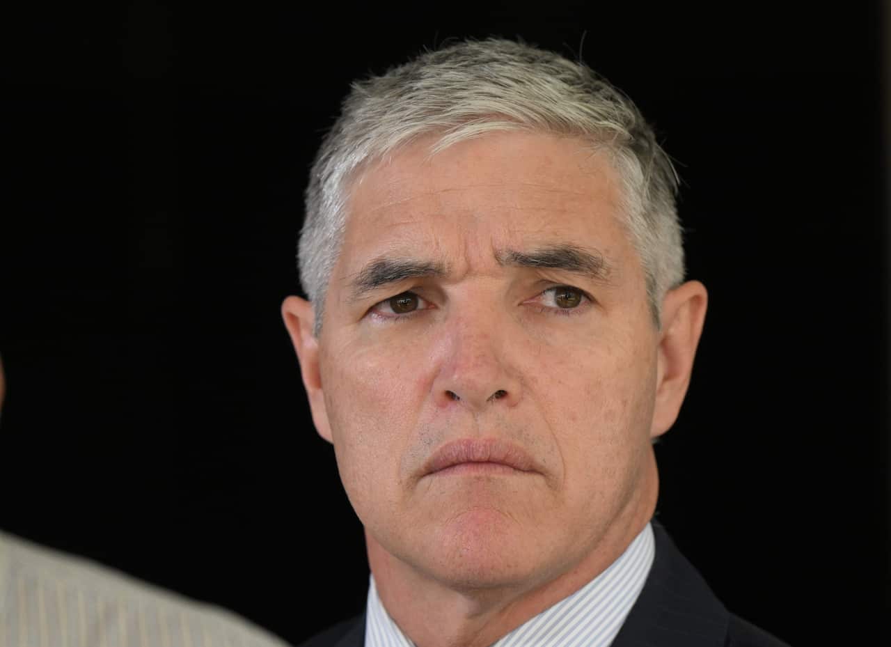 Close up of a man in a suit.