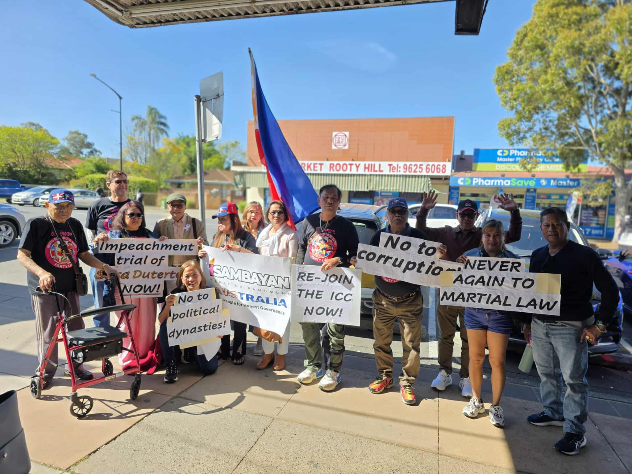 A group of Filipinos in Rooty Hill NSW joins an anti-corruption protest.