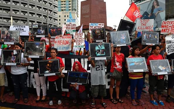 A group of people holding placards