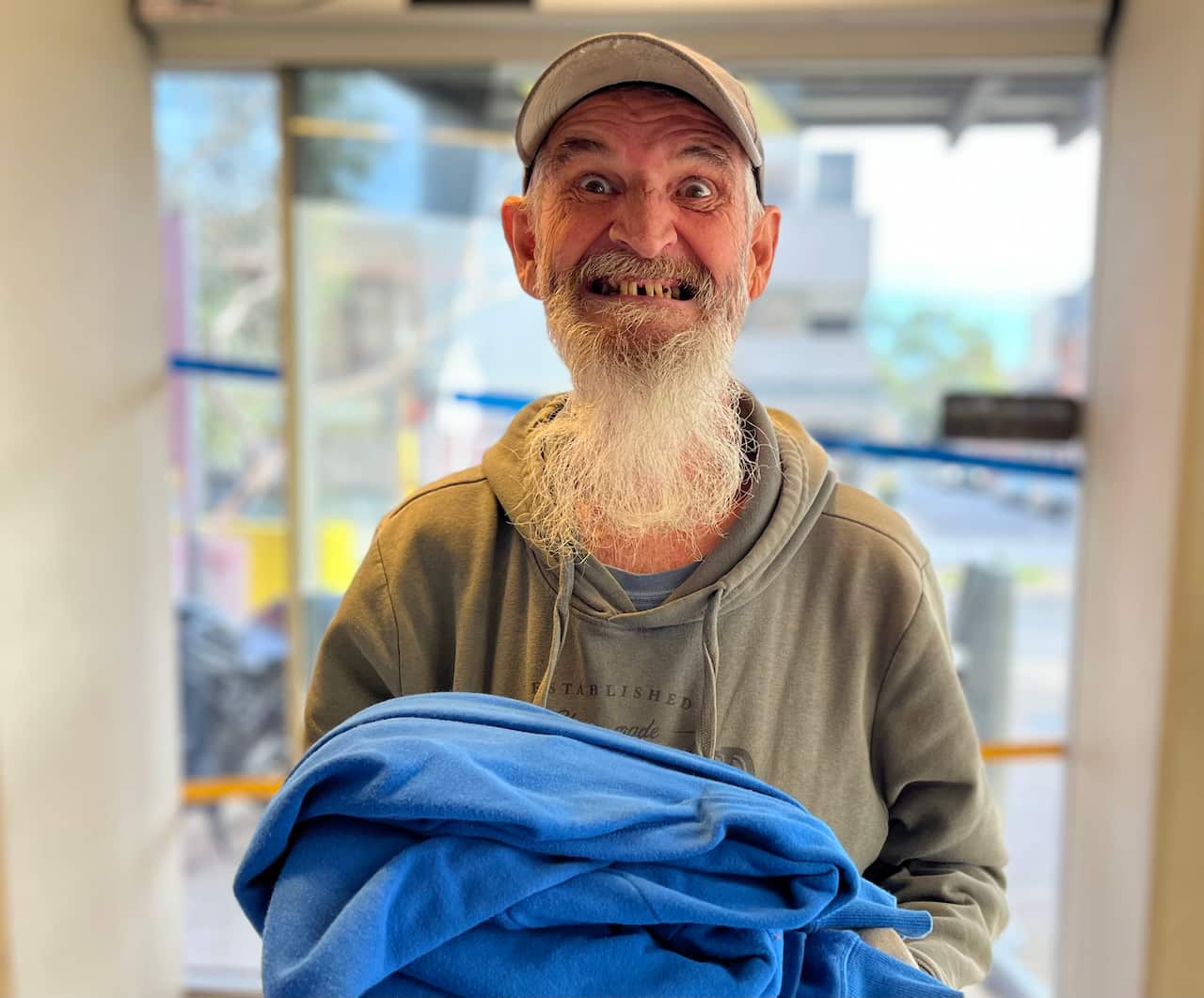 A man holding some clothes