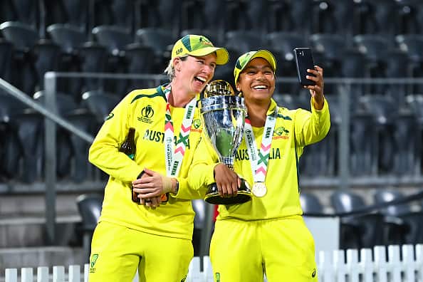 Alana King (right) and Beth Mooney take a selfie as Alana holds a trophy