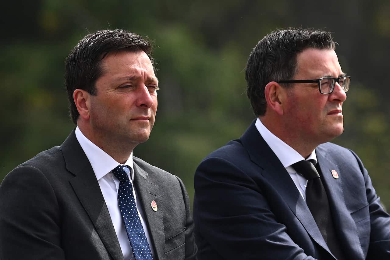 Daniel Andrews and Matthew Guy sit next to each other.