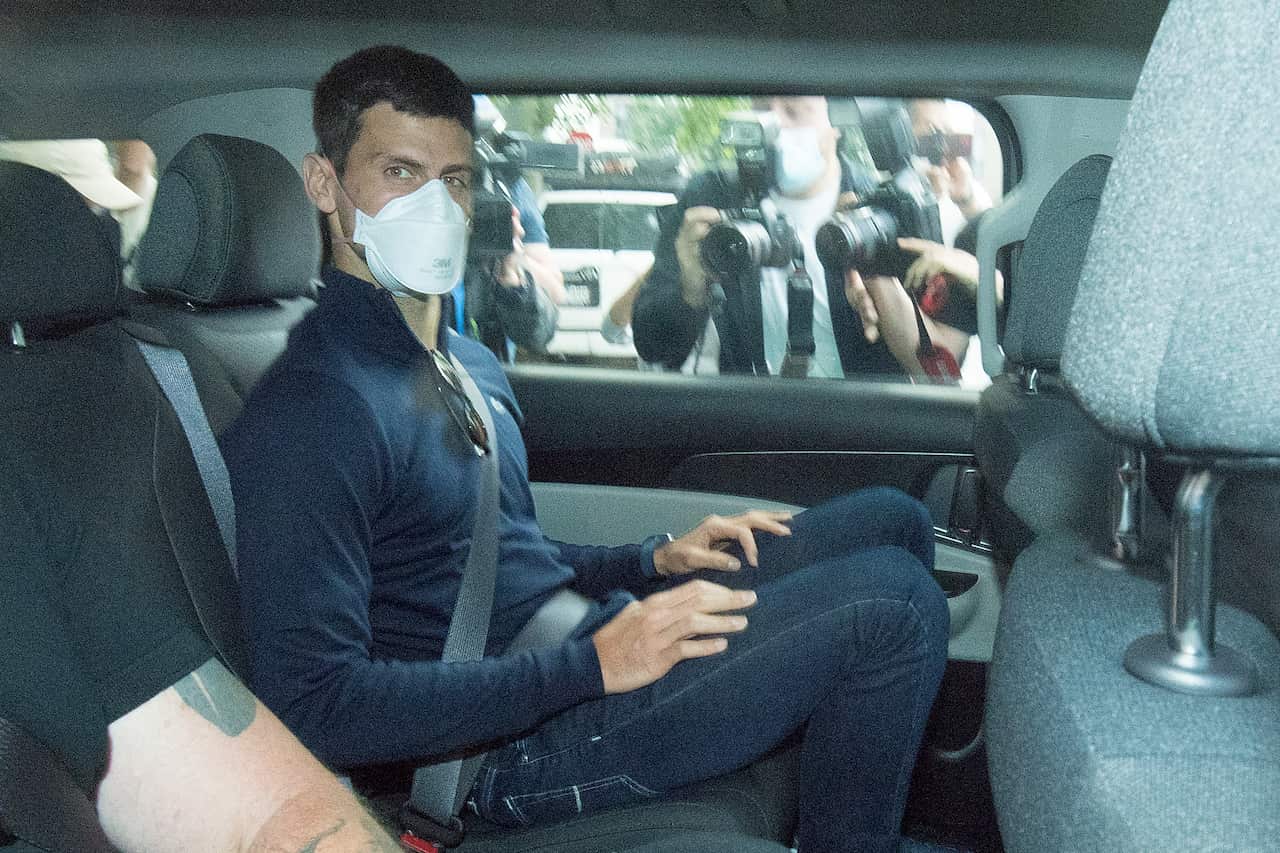 Serbian tennis player Novak Djokovic departs from the Park Hotel government detention facility.