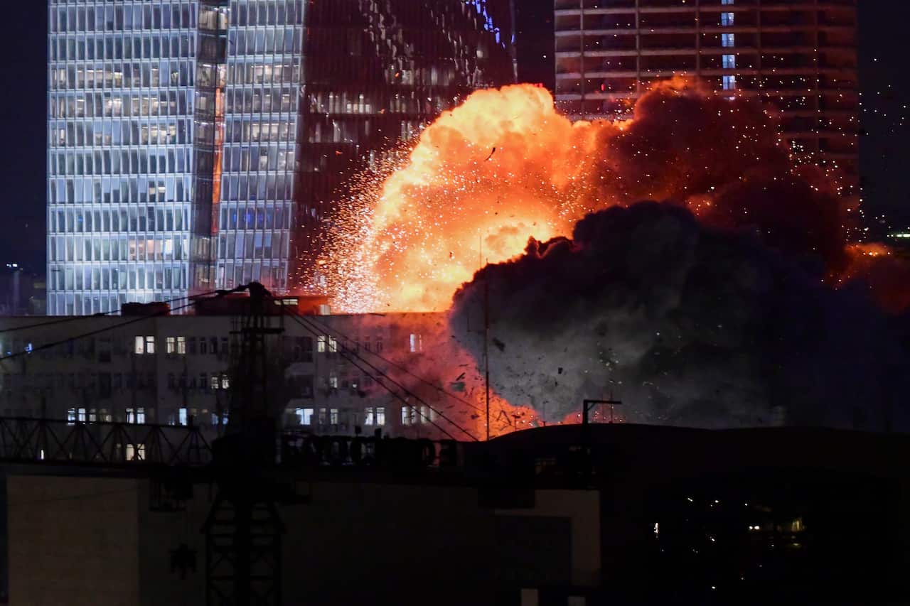 An explosion is seen during a missile attack in Tel Aviv