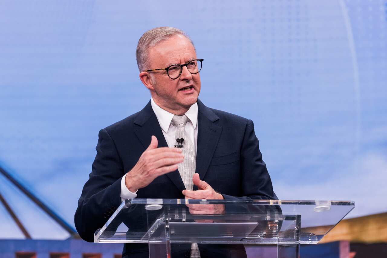 Anthony Albanese speaks at a lectern. 