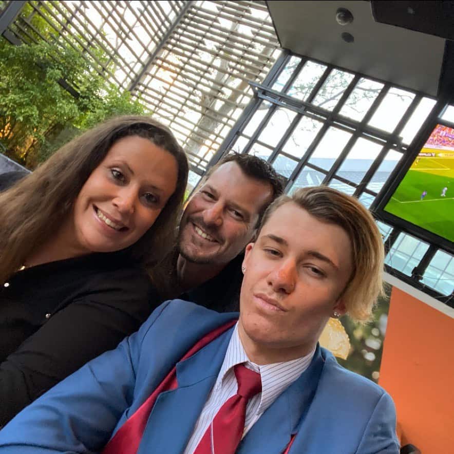 A man and two people taking a selfie