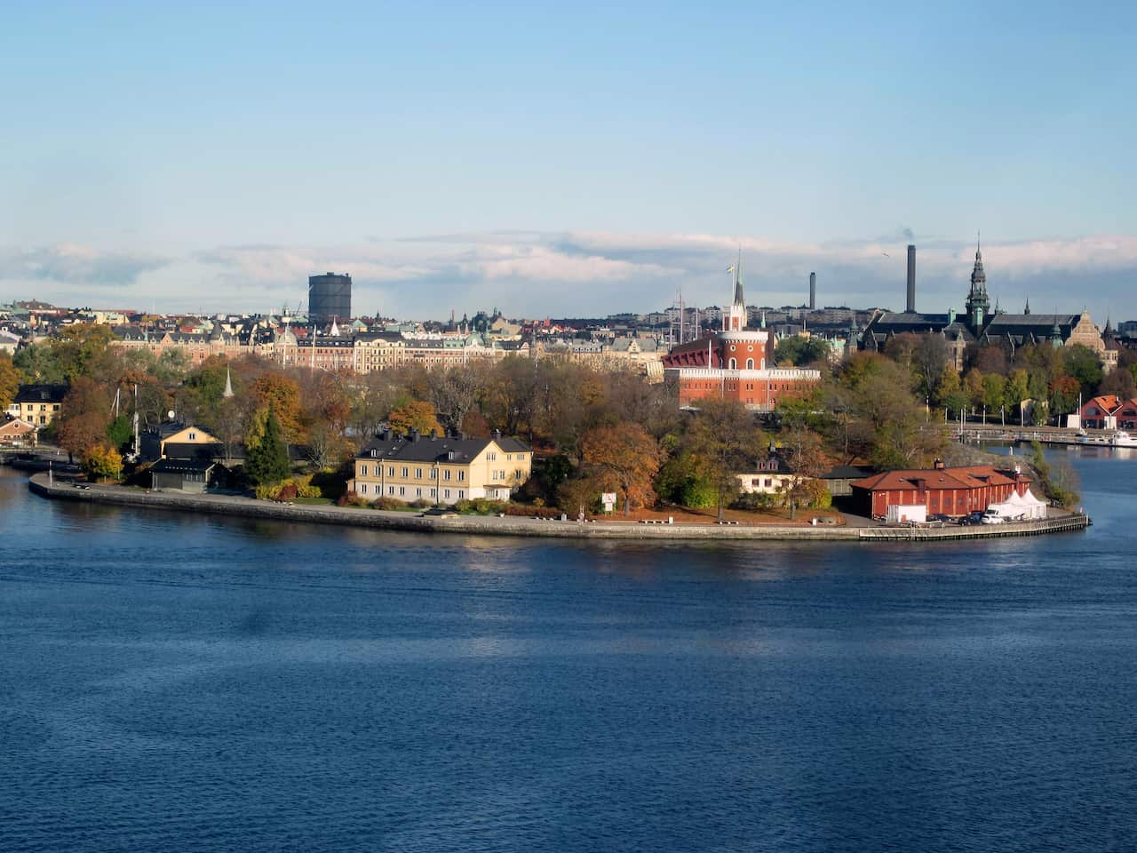 A landscape view of a harbour and buildings.