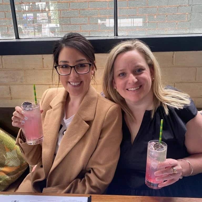 Danielle Snelling and Eloise Baker enjoying a drink together.