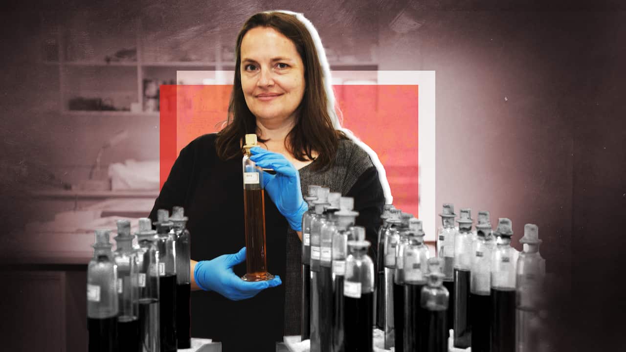 A woman with test tubes