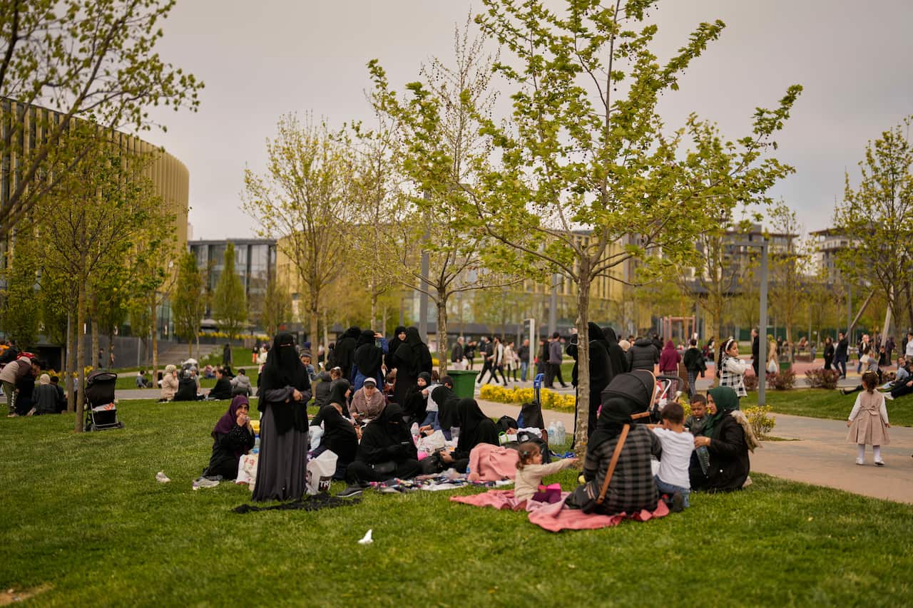 People are sitting in a park.
