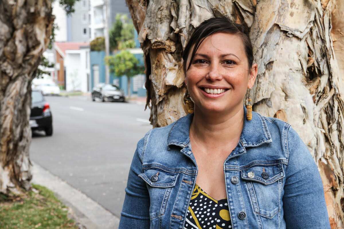 woman standing in front of tree