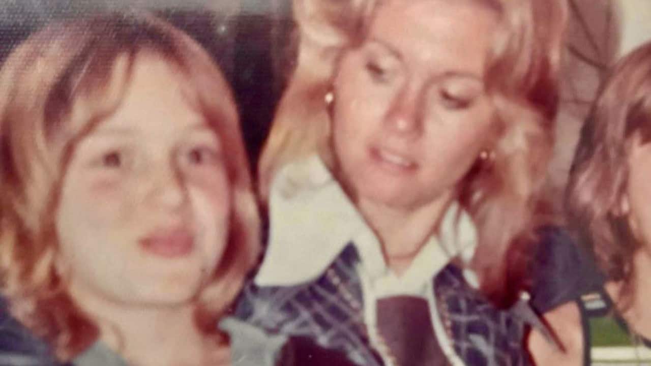 a vintage photo of a young blonde child and a young blonde woman in 70s style clothes