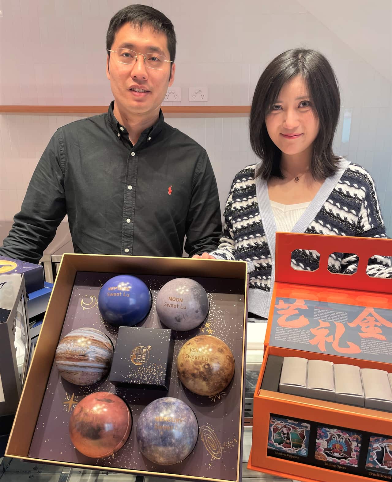 Sweet Lu's Steve Hou and Lucy Lu with mooncake gift boxes