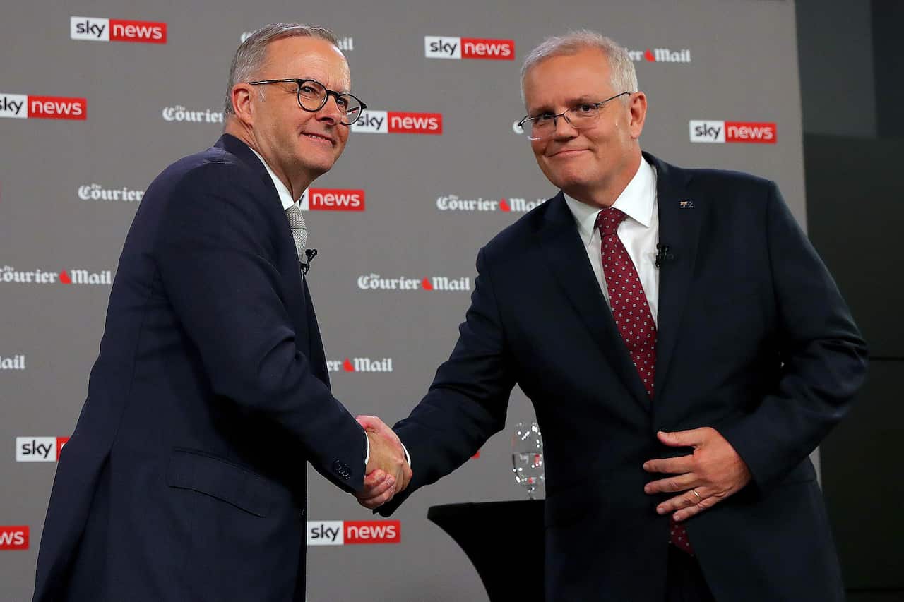 Anthony Albanese (left) and Scott Morrison (right) shake hands