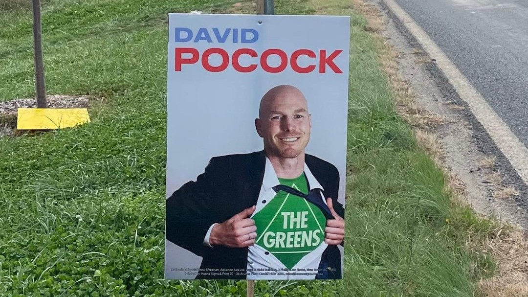 An Advance Australia sign depicting ACT independent Senate candidate David Pocock as a "Greens superman"