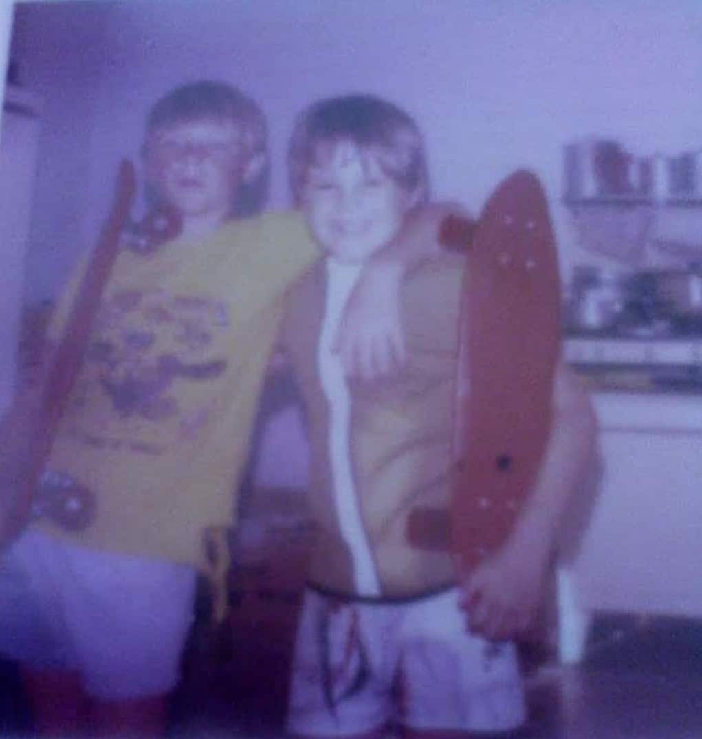 Two young boys holding skateboards