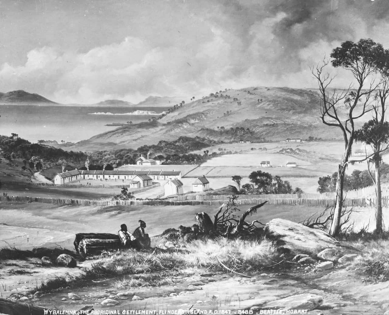 A black and white print of buildings on an island with the sea in the background. 