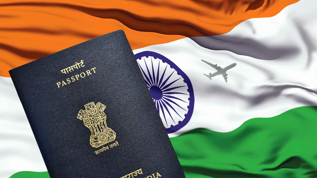 Indian passport lying on Indian flag