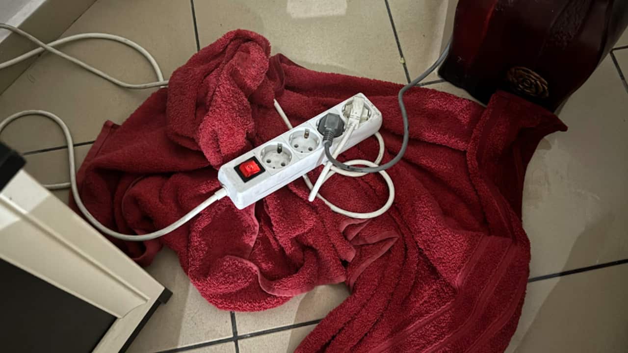 a photo of a power board on a red towel on the floor