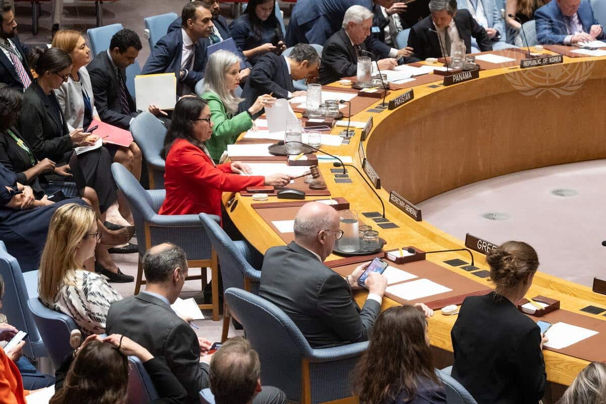 People are sitting in rows arranged in a semicircle.