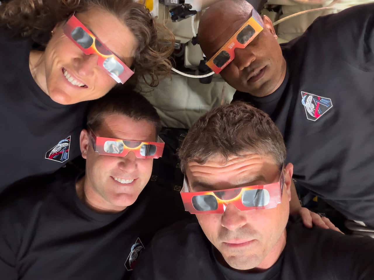 Artemis crew wearing goggles to protect them from a solar eclipse