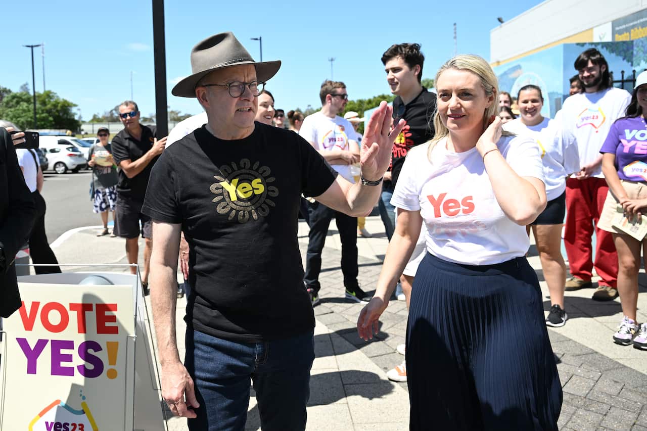 Anthony Albanese waves in a Yes shirt.