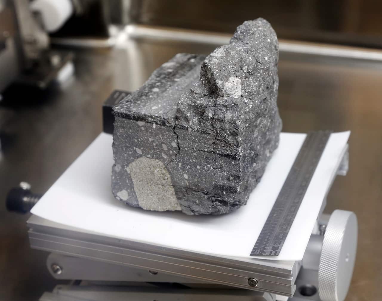 A rock on a small metal platform.