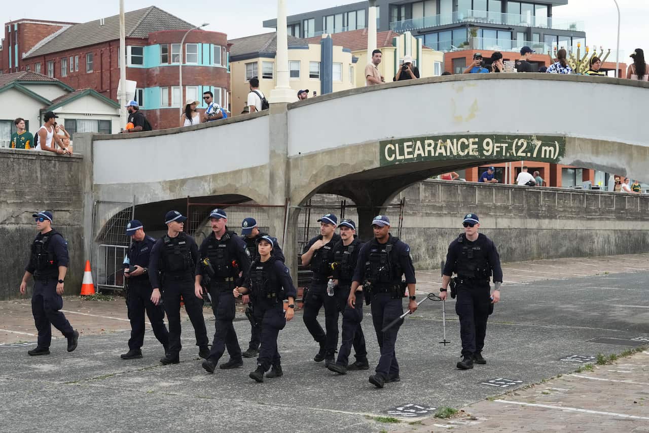Police near a bridge.
