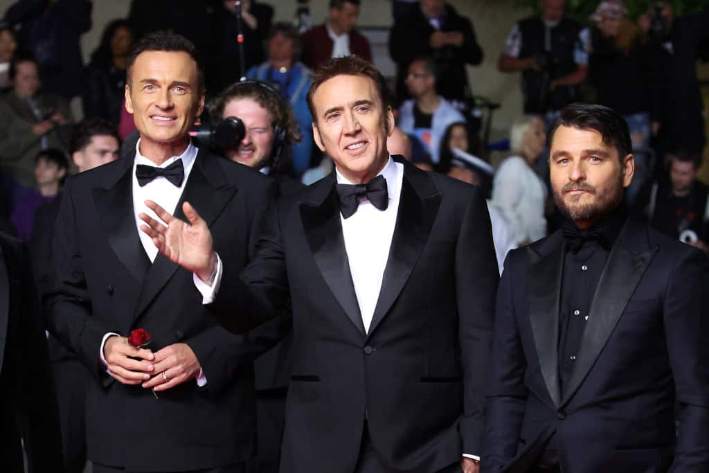 Three men wearing suits