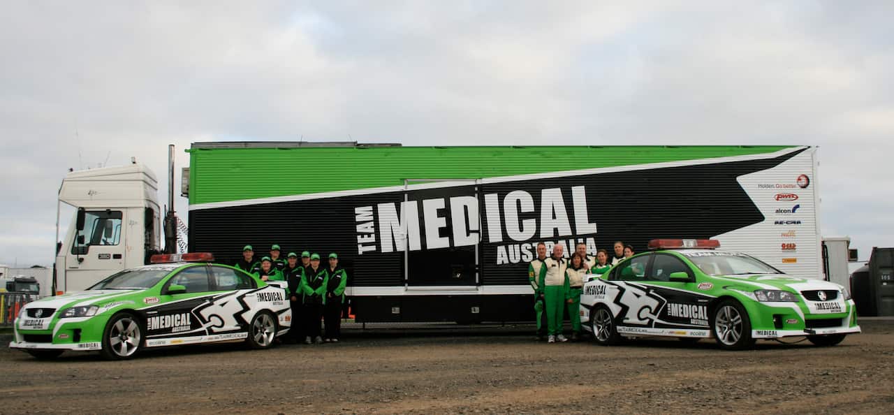 Dr Carl with Team Medical Australia - Holdens & truck obtained through contacts.JPG