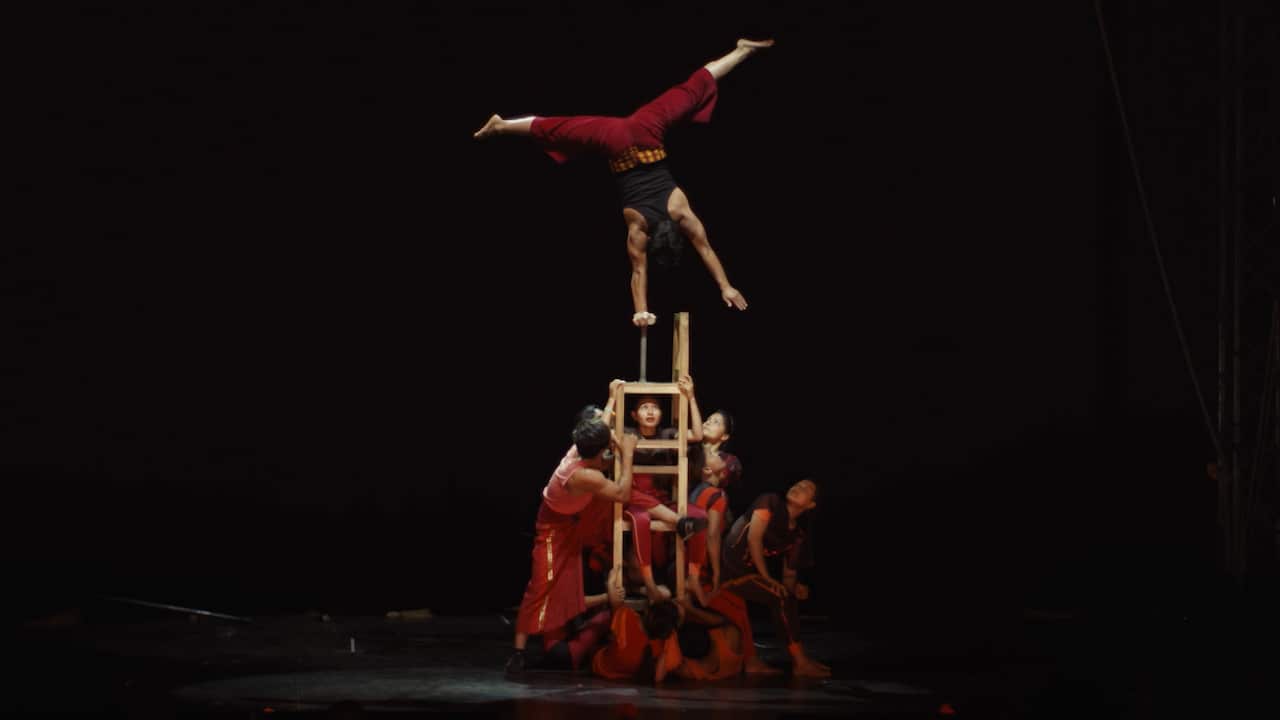 A circus act by a team of performers.