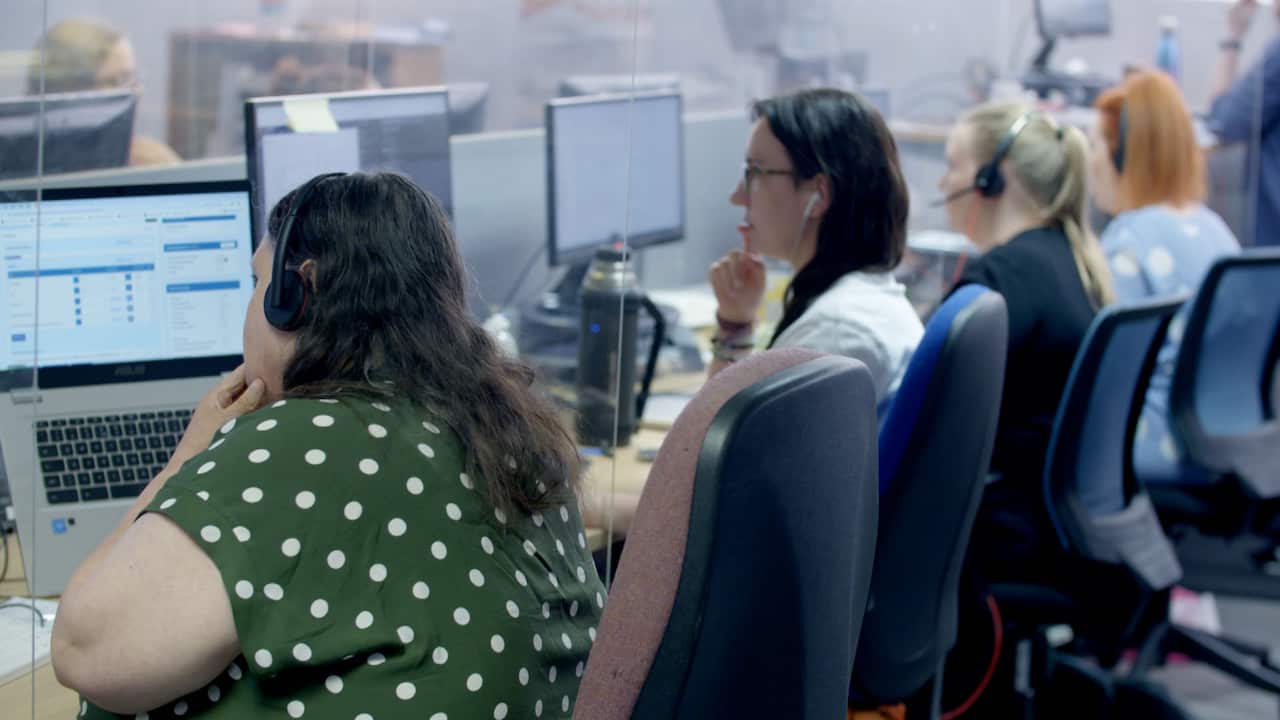 Four women working at a call centre