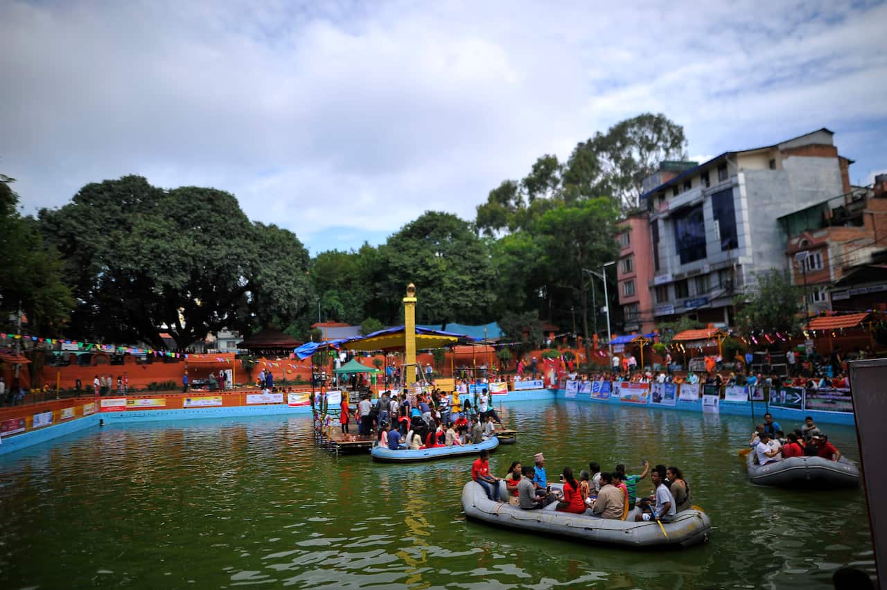 Devotees at Nag Pokhari, Kathmandu on Nag Panchami.