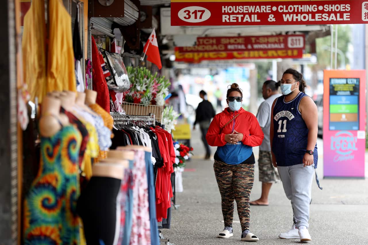 People on a street near a market in New Zealand