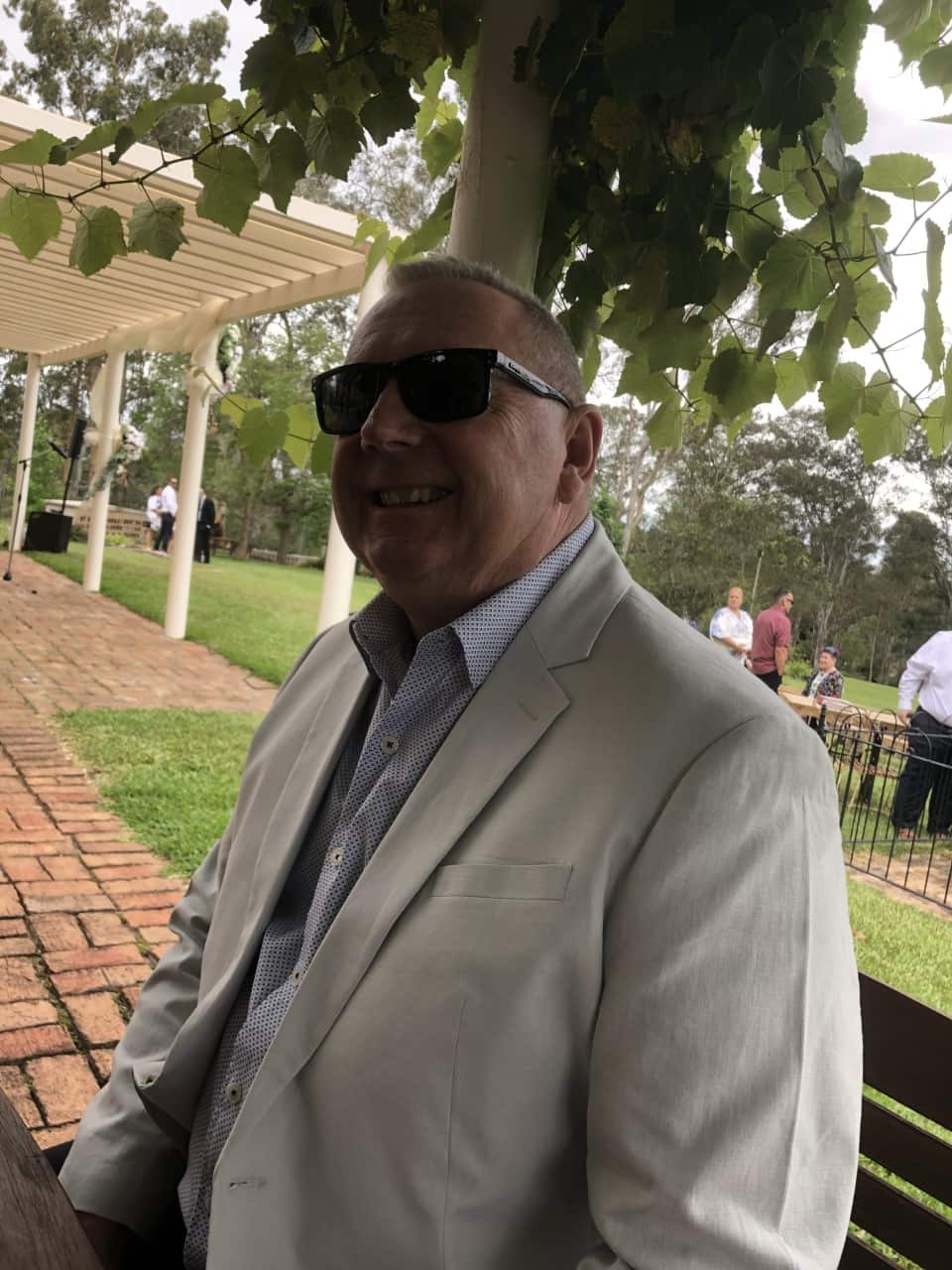 Paul in a suit at a formal event.