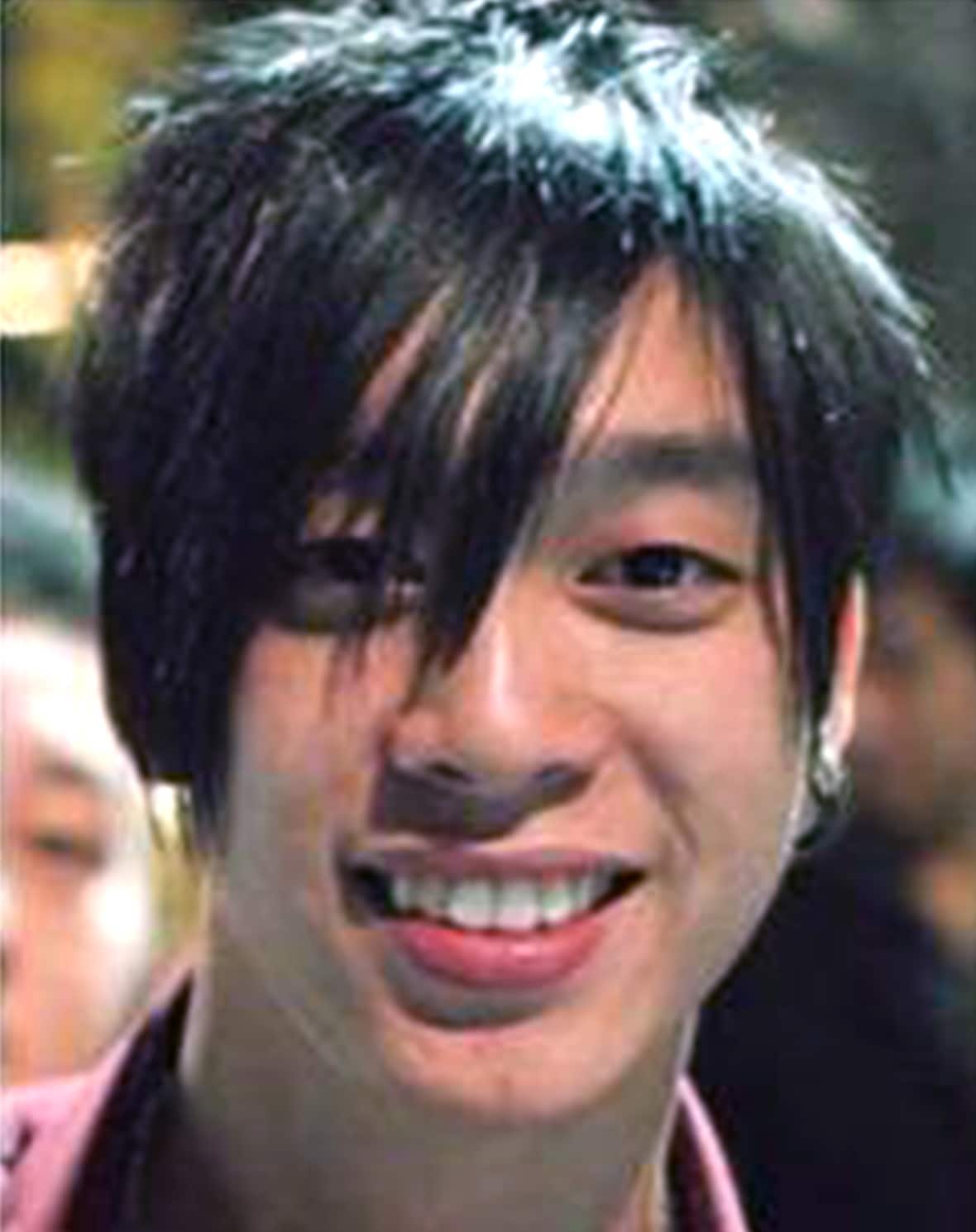 A close-up of a man smiling