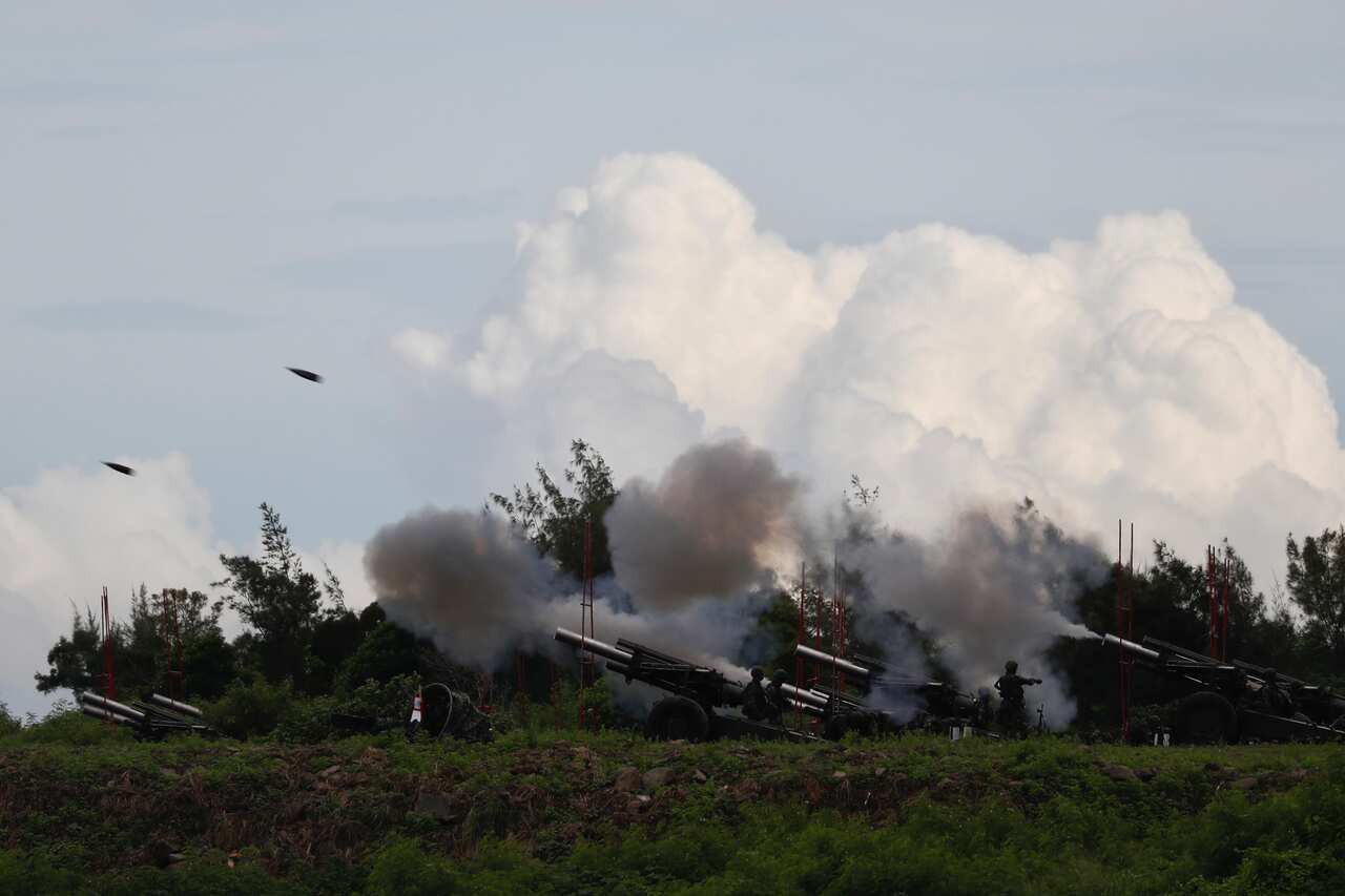 Taiwanese soldiers fire artillery during a live-fire drill.