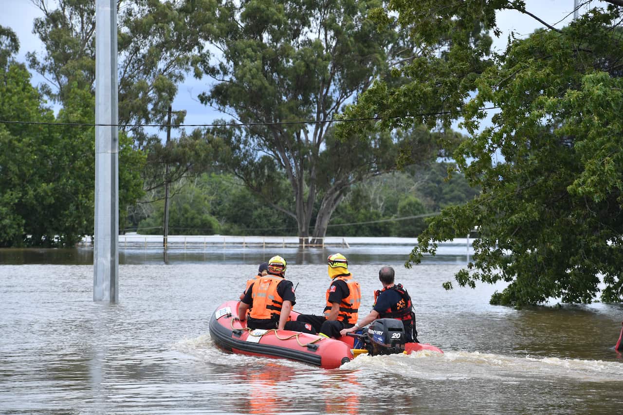 SES volunteers launch are seen in an inflatable rescue boat.