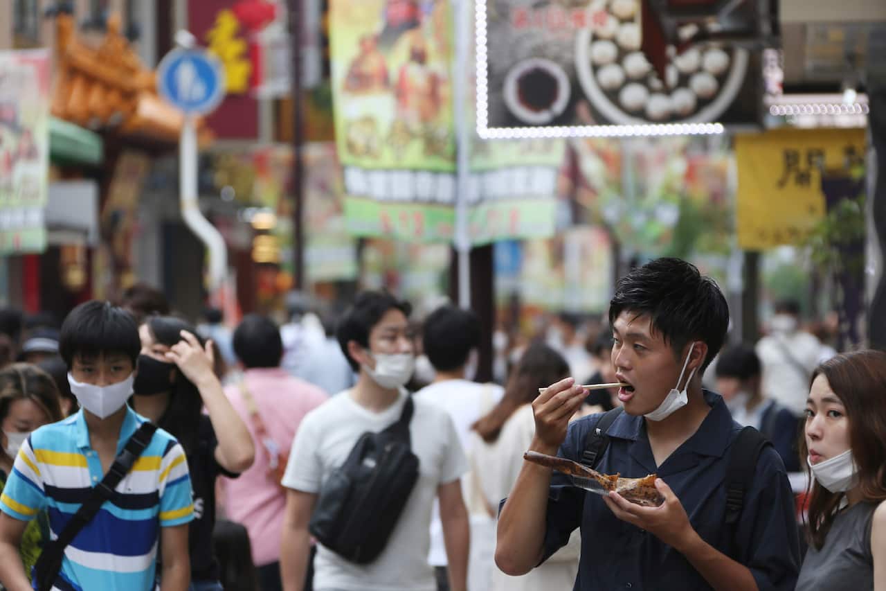 A man eats Chinese food in Chinatown in Yokohama, near Tokyo.