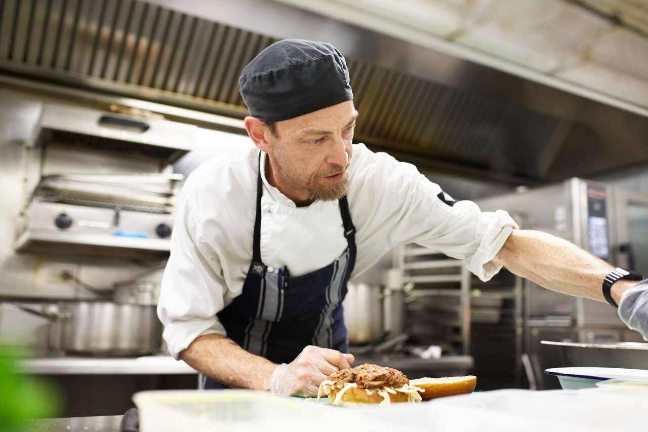 Chef in Kitchen near stove