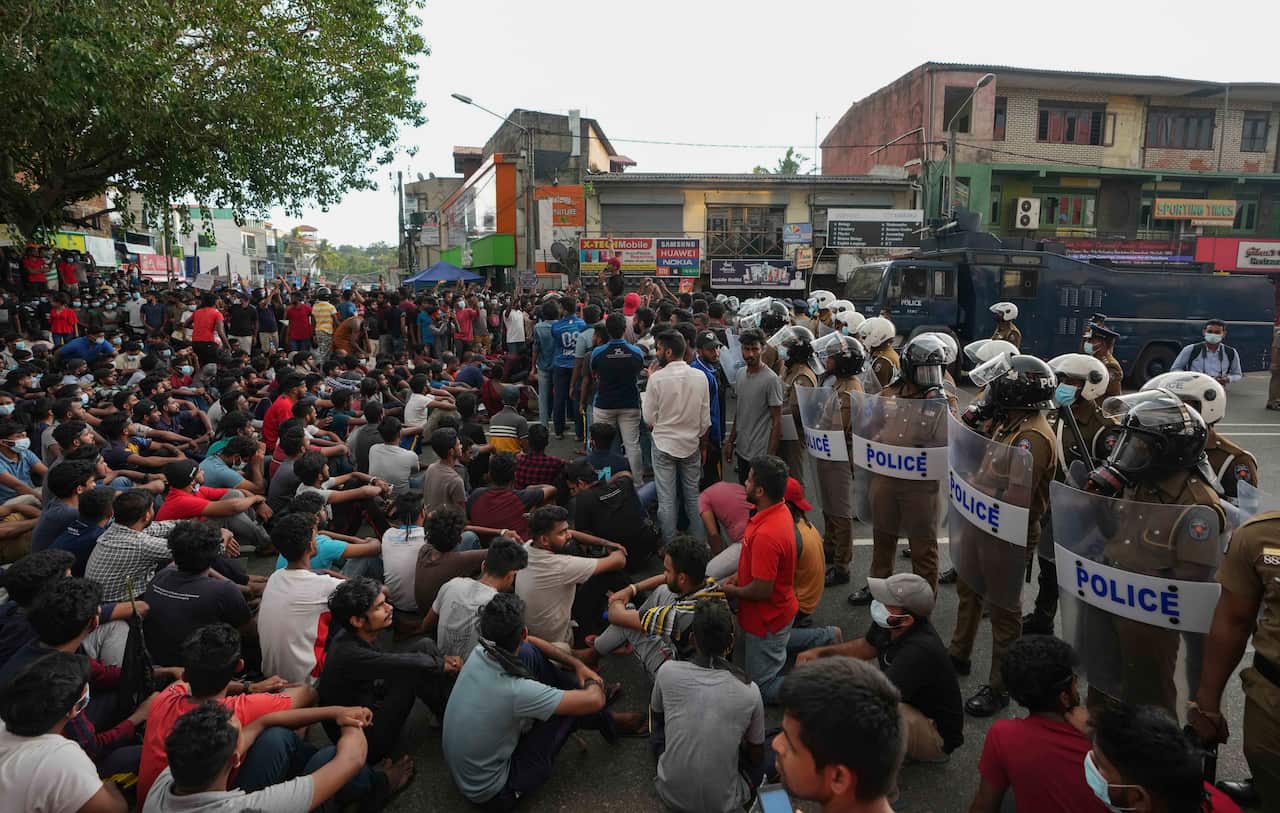 Protesters are seen blocking a highway.