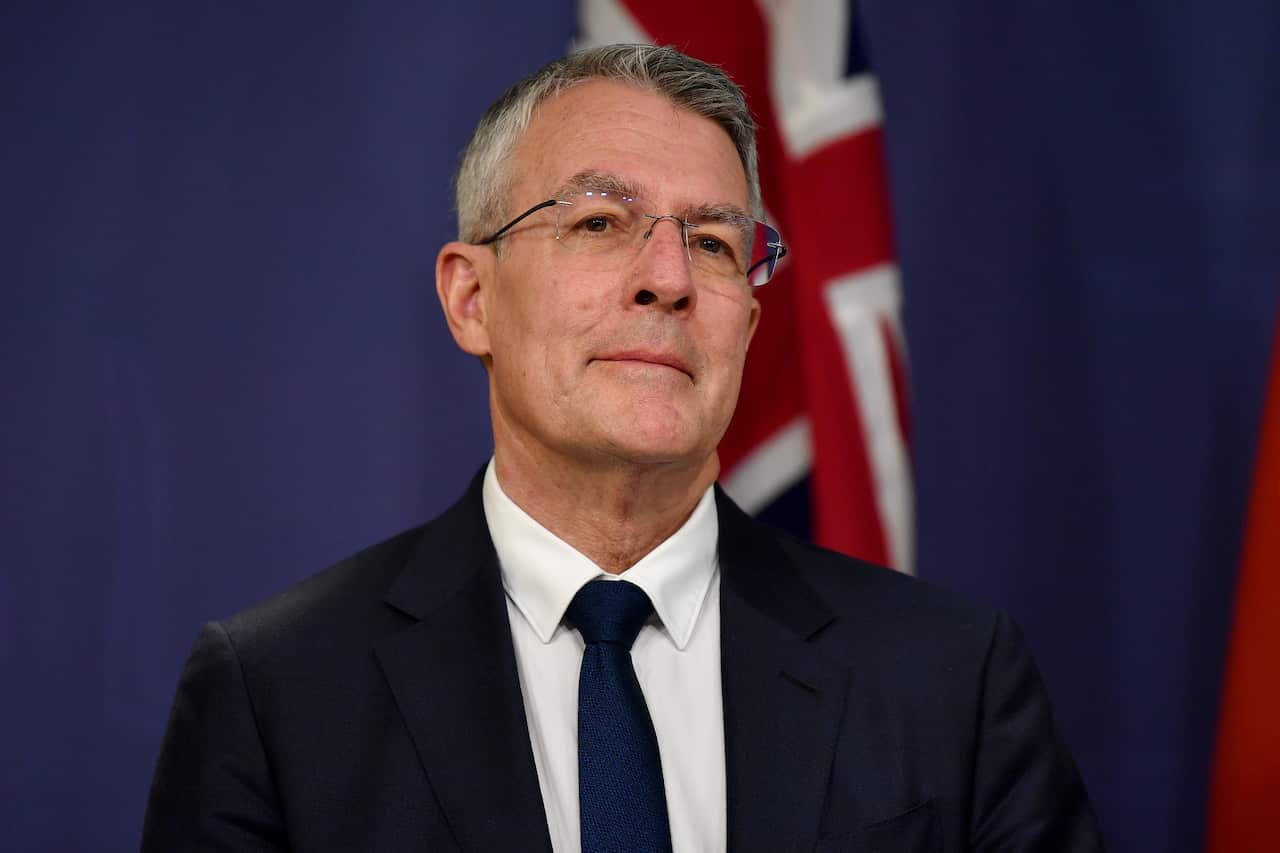 Man in glasses and a suit.