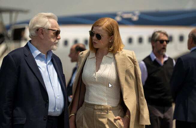 A man and a woman on a tarmac