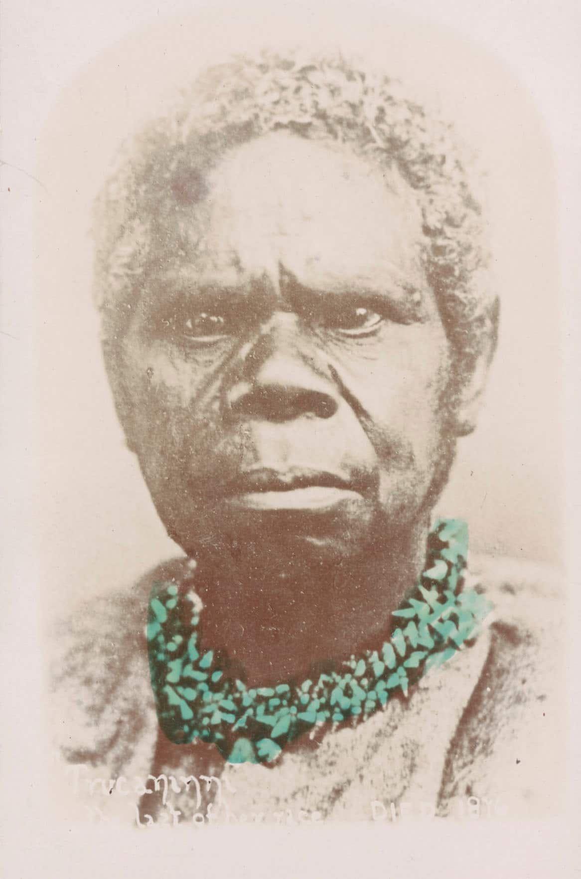 a photo of truganini wearing a mariner shell necklace, which has been falsely coloured with the distinctive pearlescent aqua of those shells. 
