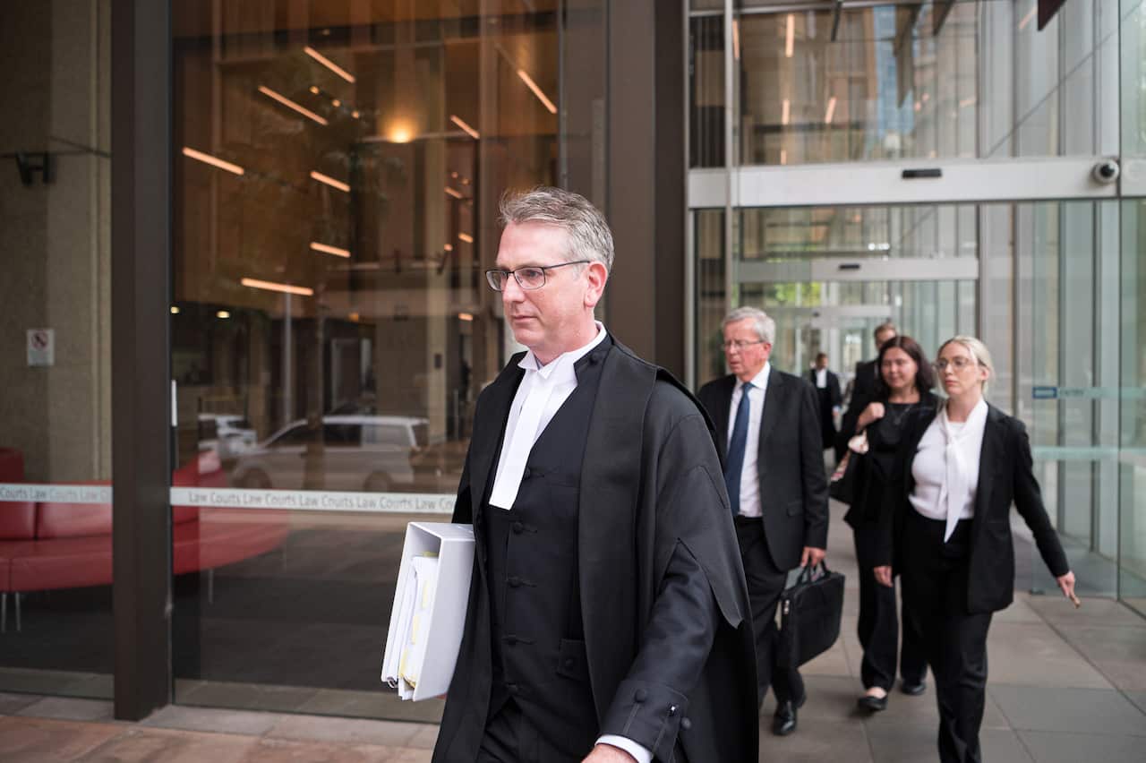 Nicholas Owens SC leaves the federal court of Australia, dressed in his robes