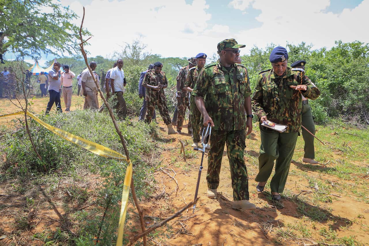 Police officers walking outside.