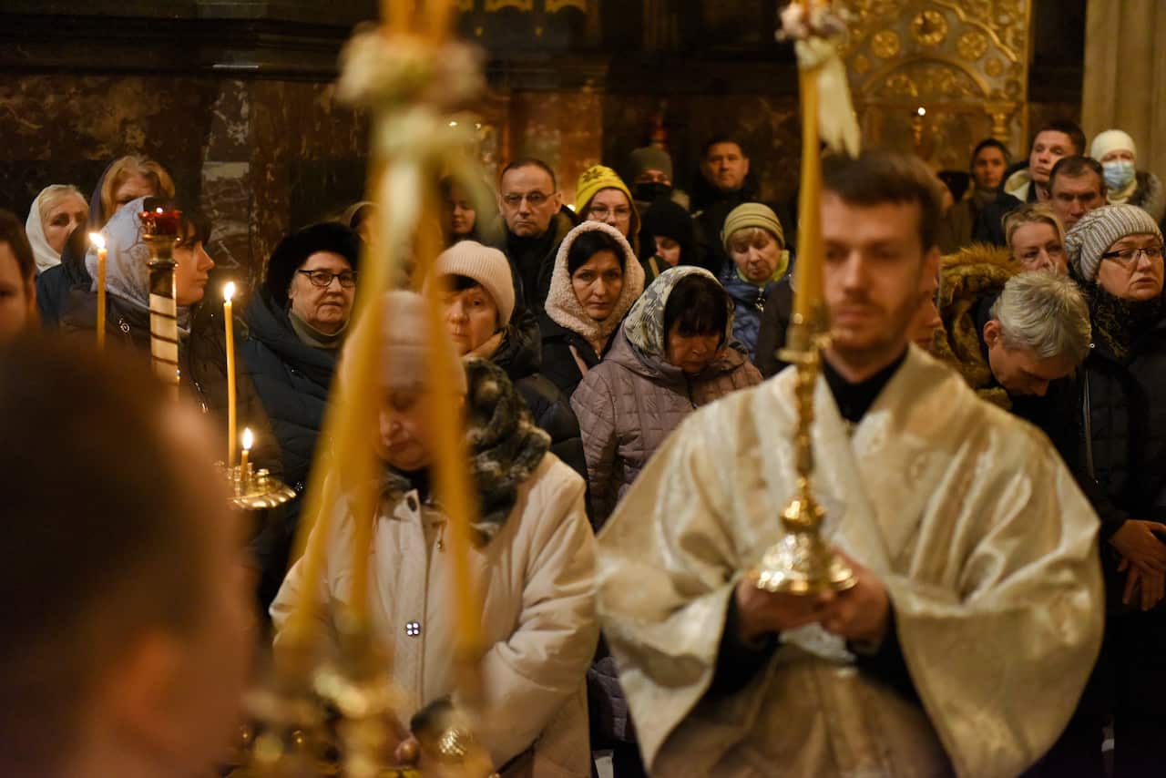 People attend an Orthodox Christmas eve service at a church in Ukraine.
