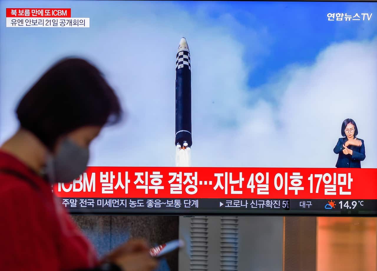 A TV screen shows North Korea's KCNA releasing a picture of