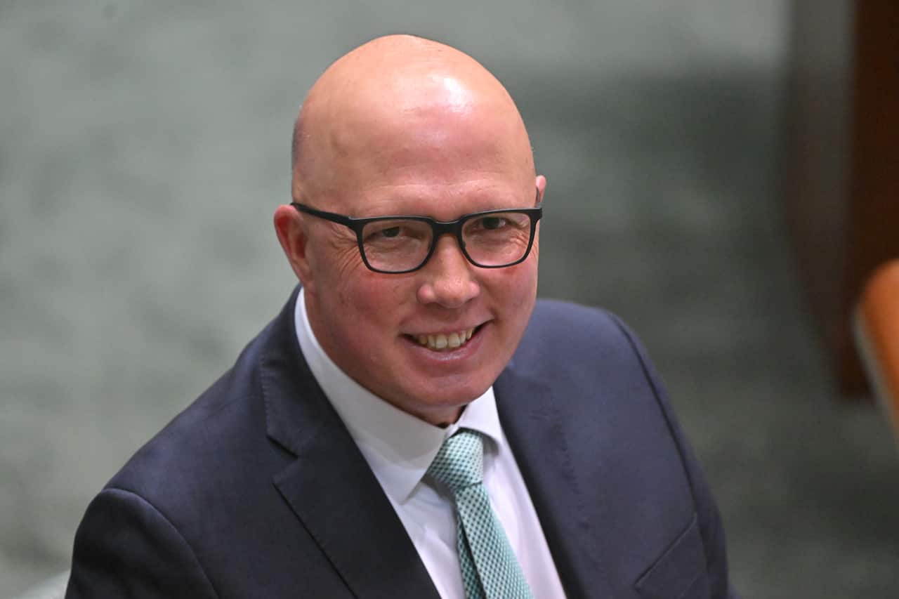 Peter Dutton smiling at the camera.